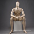 Golden fashion design boutique abstract egg head face full body sitting display male mannequin